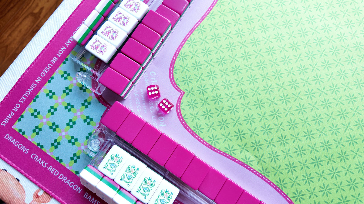Mahjong tiles arranged on a cushioned playing surface