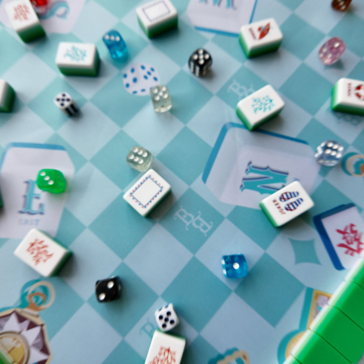 Mahjong tiles and racks displayed on a Balagigi mat